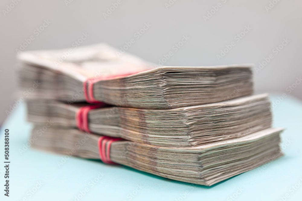 Paper money pack . Stack of Banknotes . Heap of real money Paper money pack . Stack of Banknotes . Heap of real money