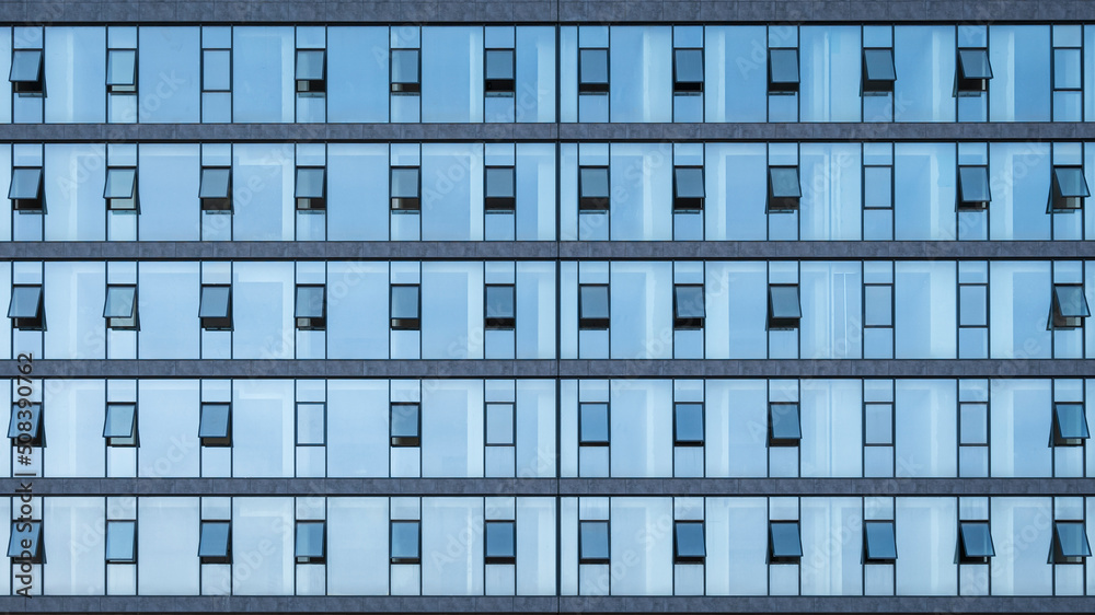 Obraz premium Office windows facede. Blue glass and steel frame,background texture. front view