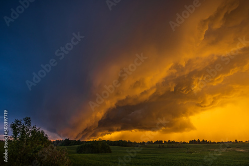 Storm cloud in the sunset light, shelf cloud with dramatic light © lukjonis