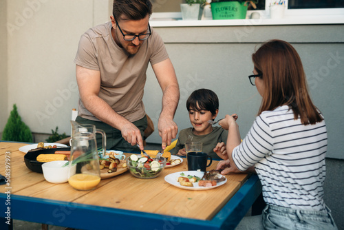 family spoil their kid. family lunch photo