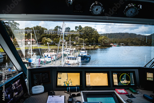 view from boat in the harbour at strahan tasmania photo