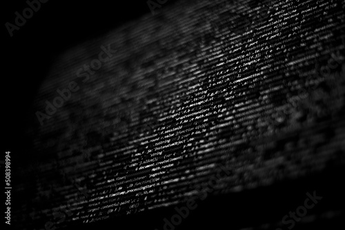 Black and white code background. javascript code on computer screen