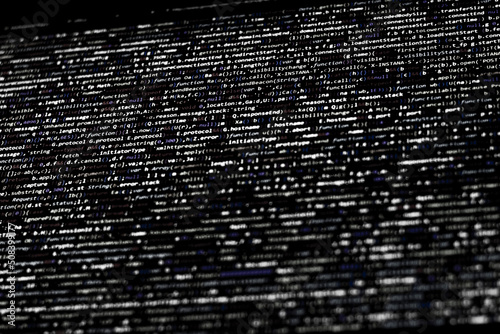 Black and white code background. compressed website javascript code