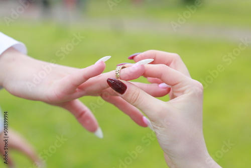 lesbian engagement proposal. Wedding lgbtq couple love. Female relashionship © Igor
