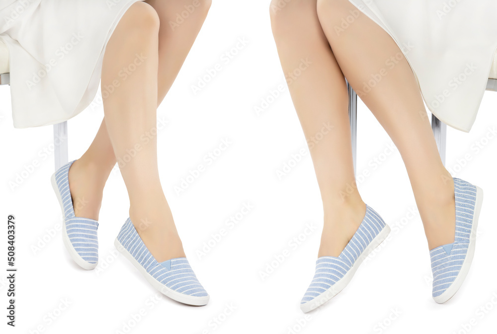 Legs in blue white striped and rhinestone moccasins on a white background. Front side view example showing shoes.
