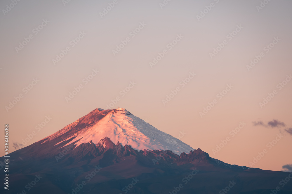 Last light on Cotopaxi volcano at sunset, Andes mountains, Ecuador