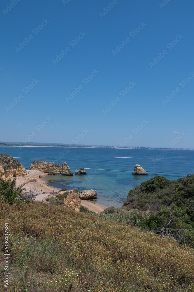 Panorama of the tourist Praia de Dona Ana de Lagos in the Algarve, Portugal in the summer of 2022