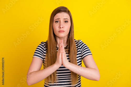 Stampa su tela Photo of young woman hands together ask beg pray wish luck wait isolated over ye