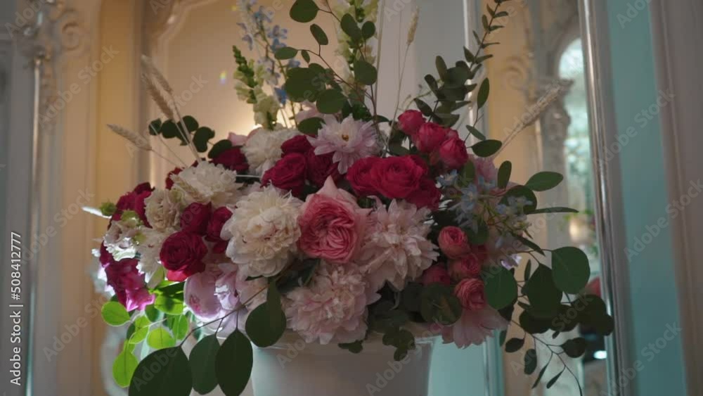 flower decoration of white and pink roses. Beautiful wedding set up. Part of the festive decor, floral arrangement. High quality FullHD footage flower decoration of white and pink roses. Beautiful wedding set up. Part of the festive decor, floral arrangement. High quality FullHD footage