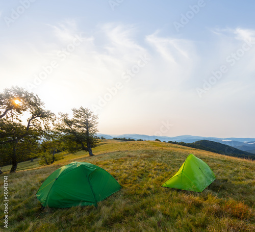 touristic camp in mountain at the morning, camping travel scene