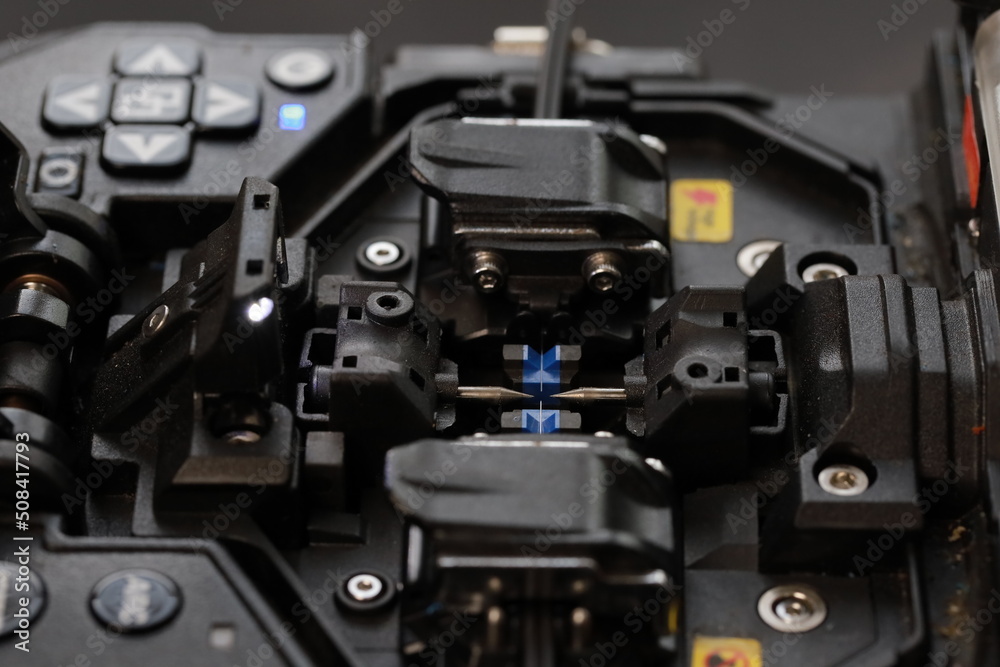 Fiber Optic Fusion Splicing Cable Internet equipment and Wire connection with Fiber Optic Fusion Splicing machine,fiber optic cable splice machine in work Fiber Optic Fusion Splicing Cable Internet equipment and Wire connection with Fiber Optic Fusion Splicing machine,fiber optic cable splice machine in work