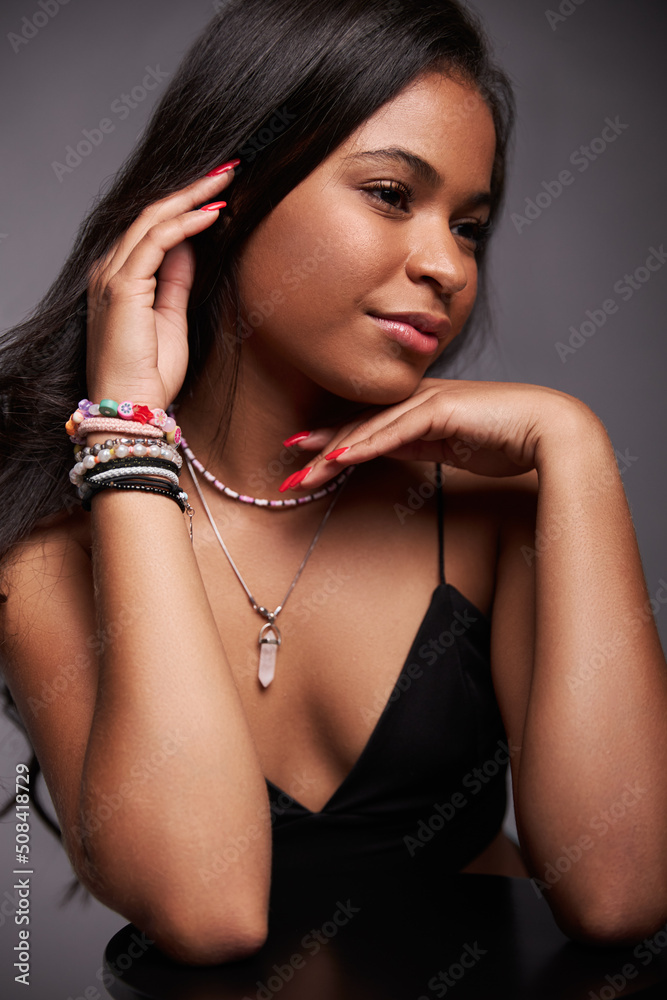 Young woman touching chin and hair