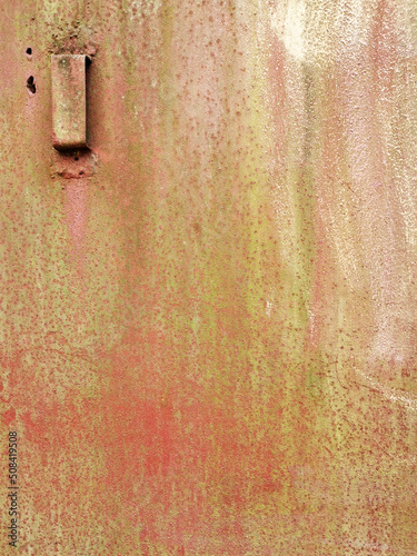 texture of an old metal garage door or fence with traces of rust