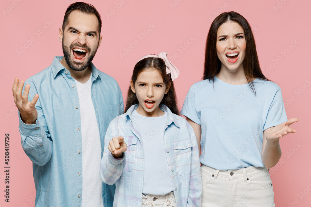 Young angry indignant parents mom dad with child kid daughter teen girl ...