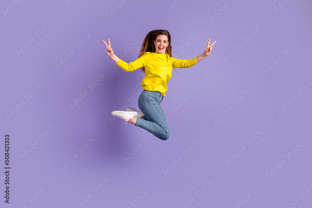 Full size profile side photo of young girl good mood jump show fingers peace v-symbol isolated over purple color background