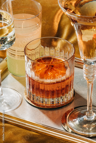 Negroni, an italian IBA cocktail with gin, bitter and vermouth; in luxury elegant home, homemade drinks