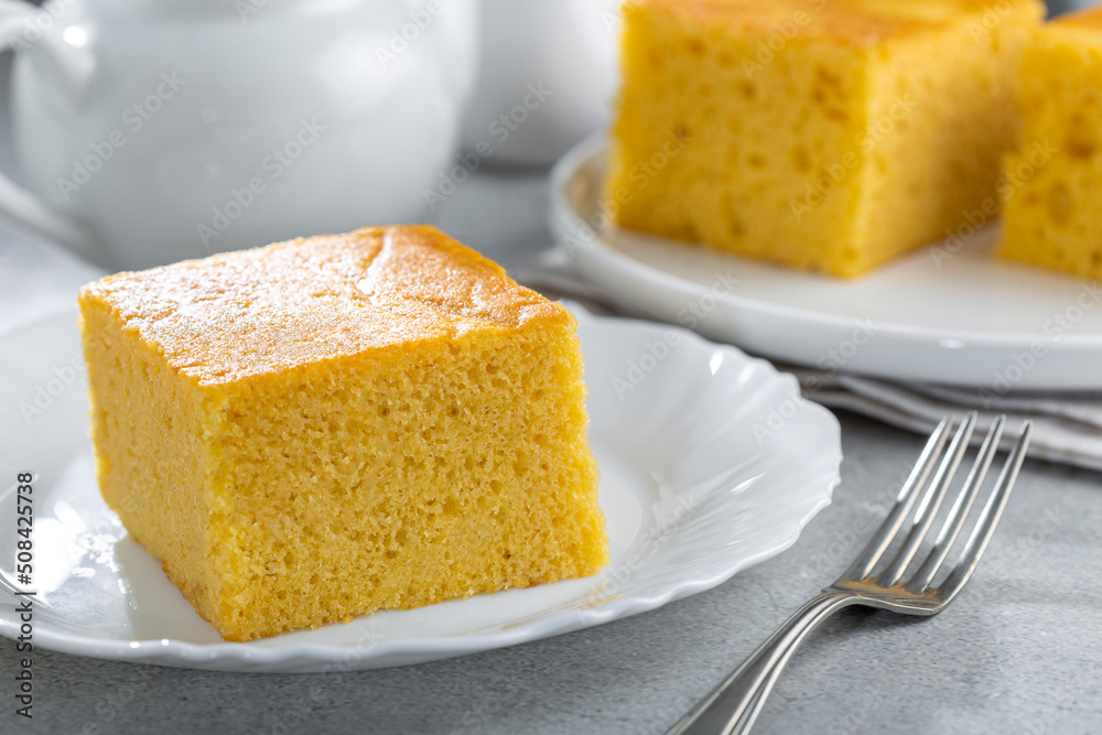 Sliced cornmeal cake on the table. Sliced cornmeal cake on the table.