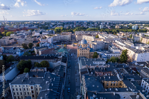 Łódź City on a sunny day. Characteristic places, buildings and streets. Piotrkowska Street from the bird's eye view.