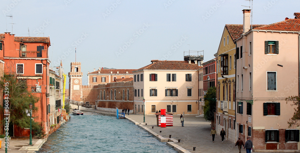 Venice canal view. Colorful facades, boats, calm river water. Beautiful architecture of Italy. Most romantic travel destinations. 