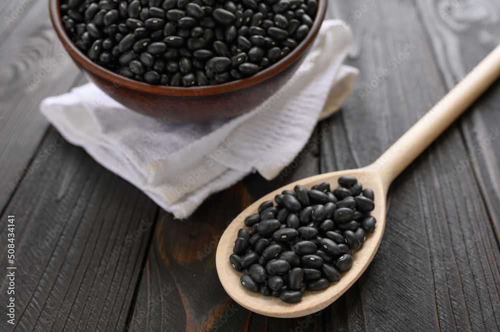 Fresh organic natural beans on wooden rustic black background Fresh organic natural beans on wooden rustic black background