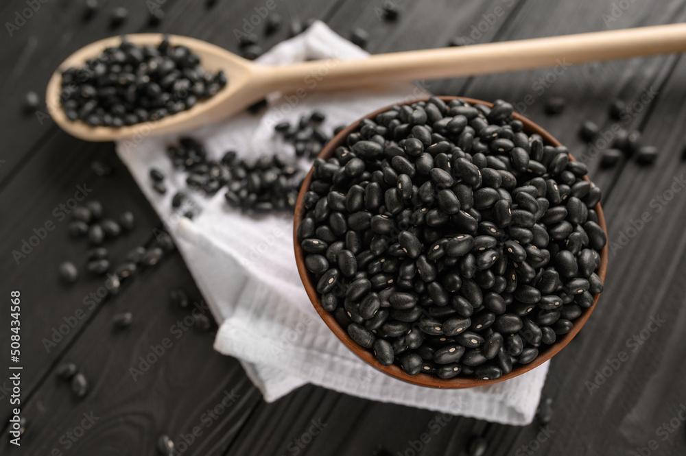 Fresh organic natural beans on wooden rustic black background Fresh organic natural beans on wooden rustic black background