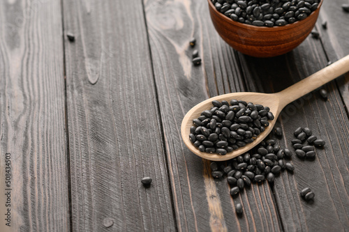 Fresh organic natural beans on wooden rustic black background