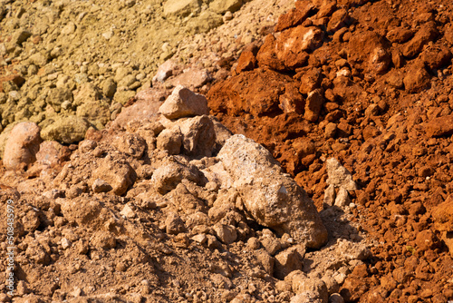 Accumulation of very dry earth with earthy colors, predominantly ocher and pink.