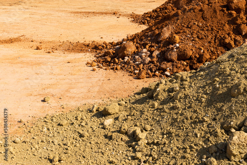 Accumulation of very dry earth with earthy colors, predominantly ocher and pink.