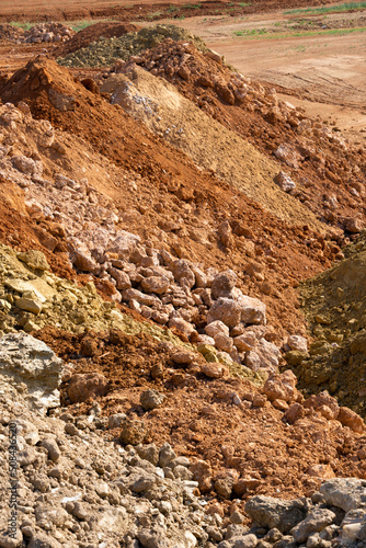 Accumulation of very dry earth with earthy colors, predominantly ocher and pink.