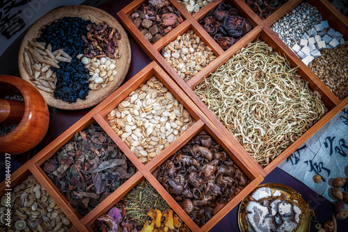 Fototapeta Naklejka Na Ścianę i Meble -  Chinese herbal medicine and flower tea on wooden