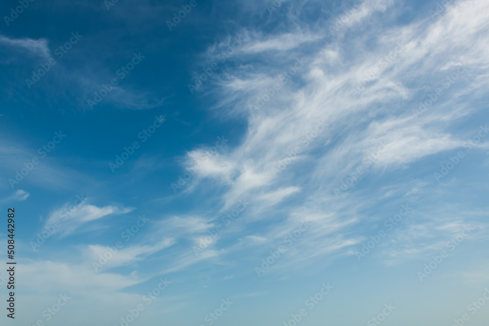 Blue sky with white clouds at sunny day. Abstract sky nature background. Beautiful summer cloudscape