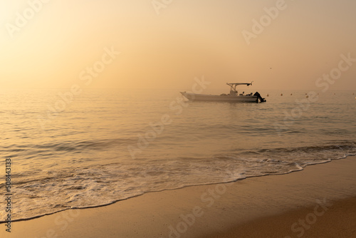 Fishing boat anchored close to shore © MalcStock