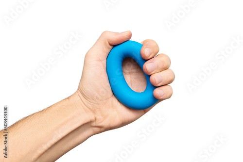 Isolated blue hand gripper or espander for exercising in fitness and strength photo