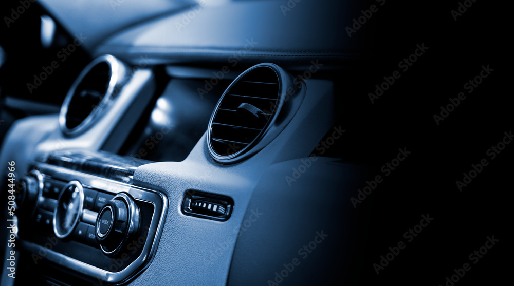 Fototapeta premium Close up of a car ventilation system with black copyspace