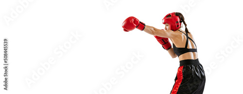 One female boxer in boxing gloves and helmet training isolated on white studio background. Sport, competition, hobby, results, success concept © master1305