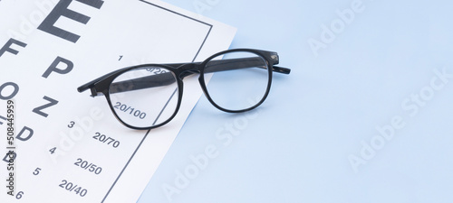 Glasses and table for checking visual acuity