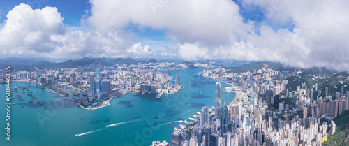 Photography Epic aerial view of the Victoria Harbour in a clear day, with thick cloud and su