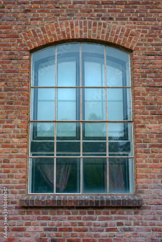 old window of a red brick building