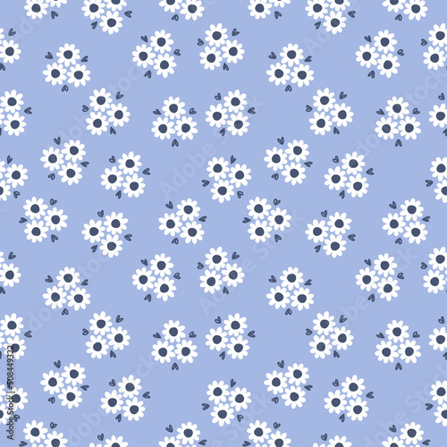 Seamless pattern with white flowers and blue background