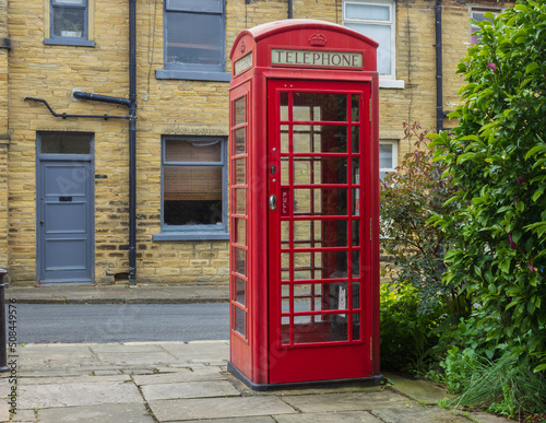 An iconic English red telephone box which were once an important lifeline but are becoming a rare sight now that almost everyone carries a mobile phone