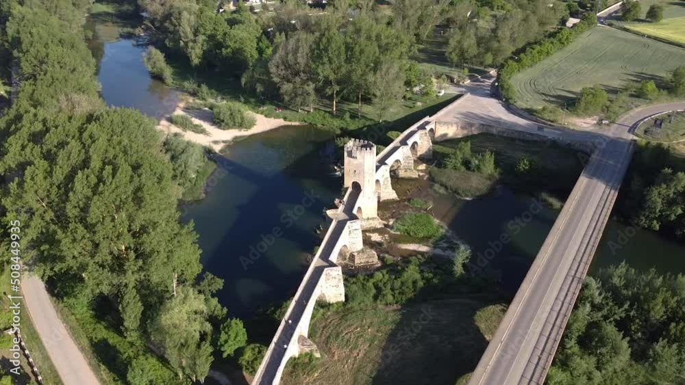aerial orbital view of the a medieval stone bridge over a river in Frias, Castilla, Spain aerial orbital view of the a medieval stone bridge over a river in Frias, Castilla, Spain