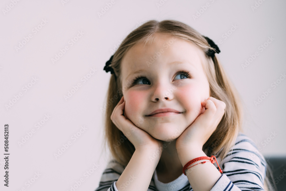 Thoughtful little girl brown-haired child touch chin with finger thinking or considering, pensive lovely daughter making decision imagining idea posing isolated on white background Thoughtful little girl brown-haired child touch chin with finger thinking or considering, pensive lovely daughter making decision imagining idea posing isolated on white background