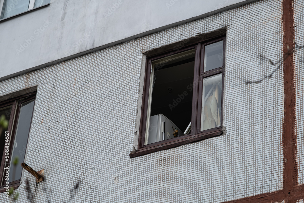 War in Ukraine 2022. Destroyed, bombed and burned residential building after Russian missiles in Kharkiv Ukraine. Broken window. Russian attack on Ukraine. Russia is bombing Ukraine