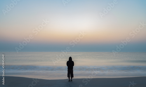 Man against a Blurry Sea Landscape, Background of the Indian Ocean at sunrise