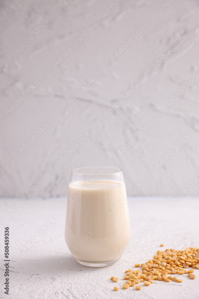 Soy milk in glass and soy bean isolated in white background Soy milk in glass and soy bean isolated in white background