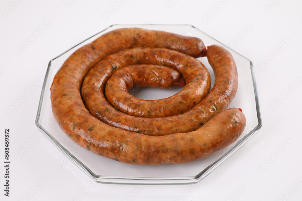 Fototapeta premium Local Northern Thai food , Northern Thai spicy sausage street food isolated in white background