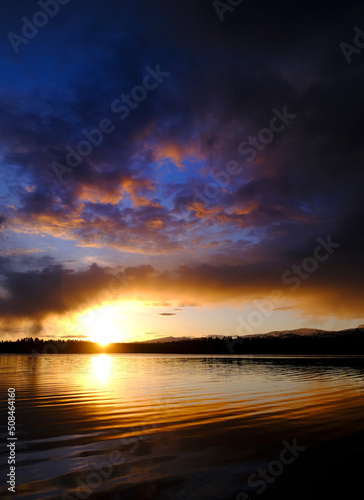 Sunset Storm Clouds Over Lake Pine Trees Wilderness