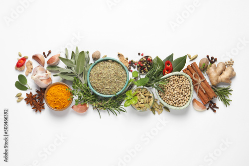 Fototapeta Naklejka Na Ścianę i Meble -  Different fresh herbs and spices on white background, top view