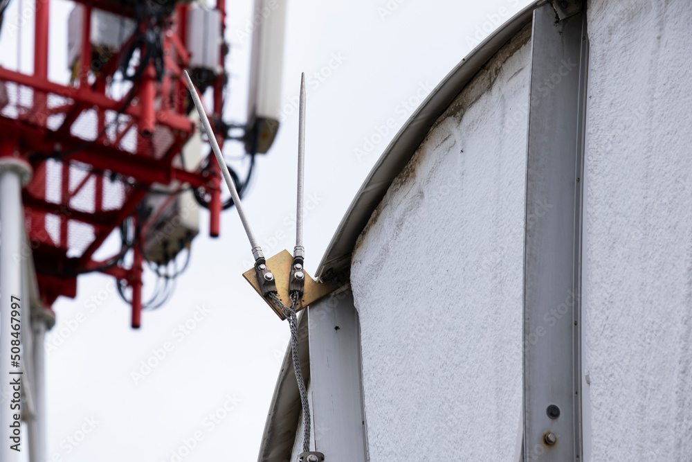 Thunderstorm protection system for a large satellite dish. Stock Photo