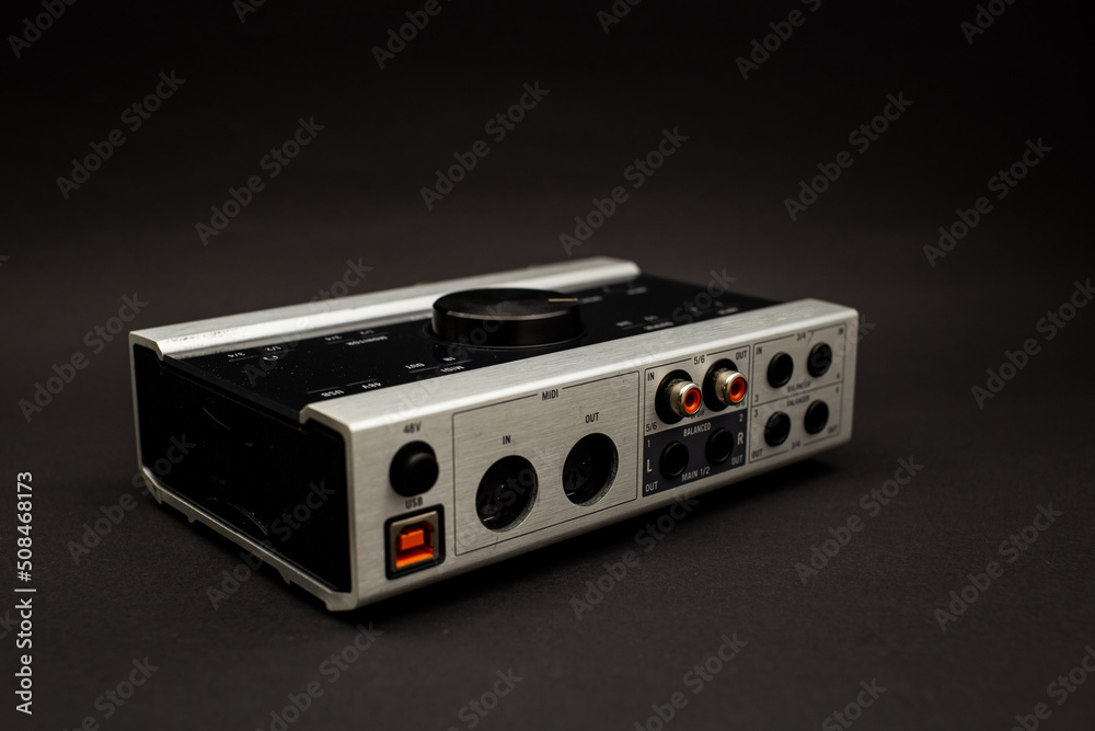 Fototapeta premium Audio mixer on a black background, a subject shot of musical instruments